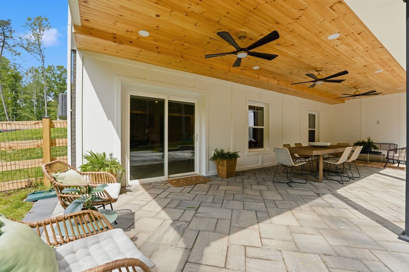 Covered patio with cedar ceiling and paver floor